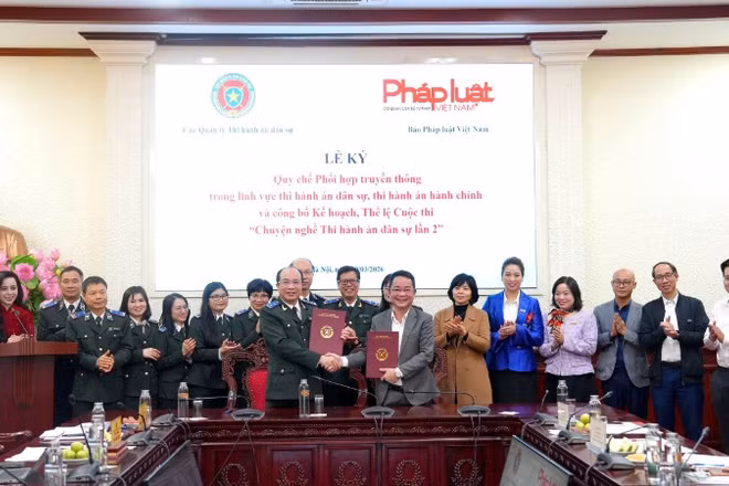 Quang cảnh buổi lễ ký kết và công bố Thể lệ Cuộc thi "Chuyện nghề thi hành án dân sự" lần thứ 2.(Ảnh: TL)