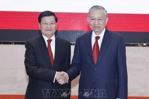 Tổng Bí thư Tô Lâm và Tổng Bí thư, Chủ tịch nước Lào Thongloun Sisoulith. (Ảnh: Thống Nhất/TTXVN)