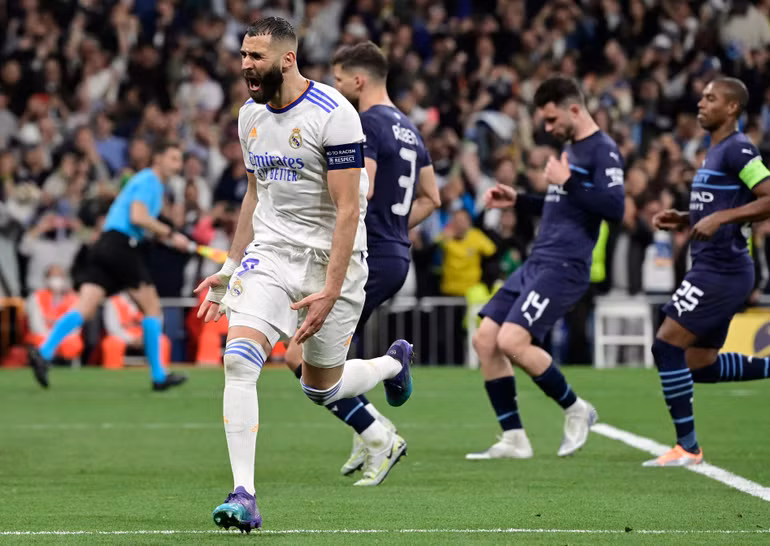 Niềm vui của Benzema khi dứt điểm 11m thành công, mang về cho Real Madrid chiến thắng nghẹt thở 3-1 trong trận lượt về và thắng lợi chung cuộc 6-5 trước Man City sau hai lượt trận. Qua đó, Real hướng tới chung kết C1 gặp Liverpool. Niềm vui của Benzema khi dứt điểm 11m thành công, mang về cho Real Madrid chiến thắng nghẹt thở 3-1 trong trận lượt về và thắng lợi chung cuộc 6-5 trước Man City sau hai lượt trận. Qua đó, Real hướng tới chung kết C1 gặp Liverpool.