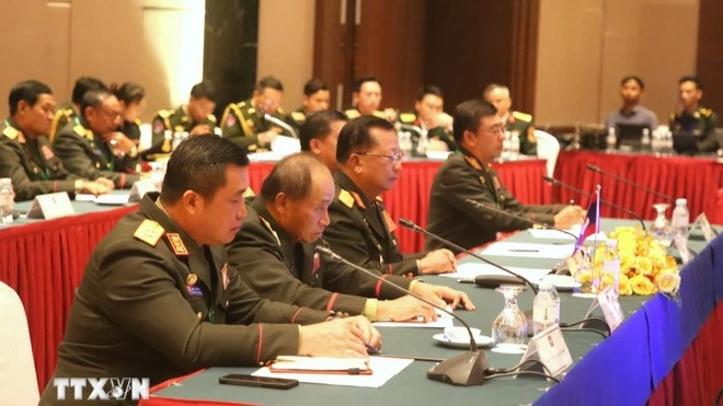 Đoàn đại biểu Bộ Quốc phòng Lào tham dự sự kiện. (Ảnh: Hoàng Minh/TTXVN)