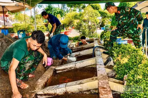 Các lực lượng làm nhiệm vụ tại Nghĩa trang Liệt sĩ Lai Vung-Lấp Vò (tỉnh Đồng Tháp). 
