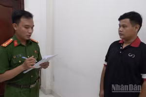 Đối tượng Huỳnh Quốc Lợi làm việc với cơ quan Công an.