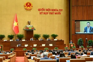 Tổng Thanh tra Chính phủ Đoàn Hồng Phong trình bày Báo cáo tiếp thu, giải trình trước Quốc hội. (Ảnh: DUY LINH)