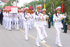Lễ bàn giao, đón nhận hài cốt liệt sĩ quân tình nguyện, chuyên gia Việt Nam hy sinh tại Lào được tổ chức trọng thể.