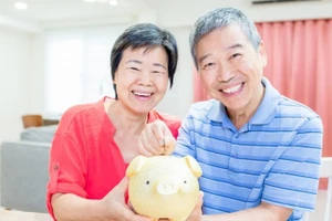 Tiết kiệm ngày đầu năm được coi là may mắn, phát lộc. (Ảnh: Vietnam+) 