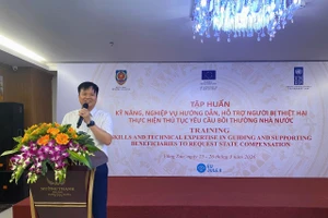 Ông Nguyễn Ngọc Vũ, Phó Cục trưởng Đăng ký giao dịch bảo đảm và Bồi thường nhà nước phát biểu tại hội nghị.