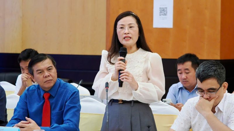 Tiến sĩ Lê Thị Mai Hoa trình bày tham luận tại tọa đàm. sggp-1.jpg