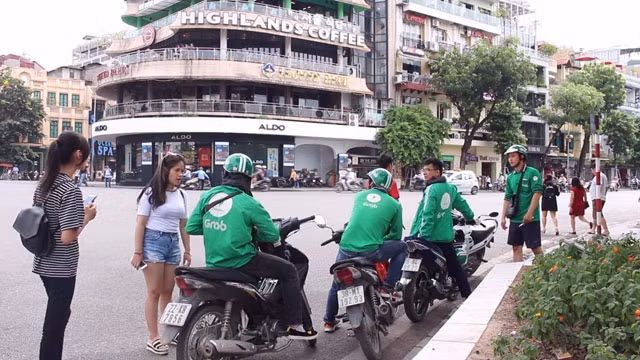 Bảo vệ NTD khi hai “ông lớn” Grab và Uber sáp nhập.