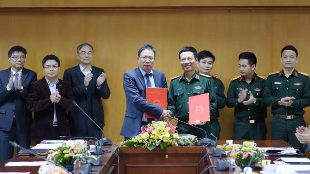 Lễ ký kết giữa VAST và Viettel ngày 28-3.