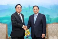Thủ tướng Phạm Minh Chính tiếp Bộ trưởng Kế hoạch và Đầu tư Lào Khamchen Vongphosy.