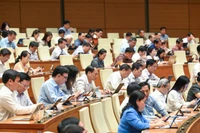 Quốc hội họp phiên toàn thể tại hội trường nghe Tờ trình và Báo cáo thẩm tra dự thảo Nghị quyết của Quốc hội về một số cơ chế, chính sách đặc biệt, tạo đột phá trong xây dựng và tổ chức thi hành pháp luật. (Ảnh: BÙI GIANG)