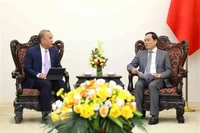 Phó Thủ tướng Trần Lưu Quang tiếp Giám đốc điều hành Văn phòng nhóm Ngân hàng Thế giới phụ trách khu vực Đông Nam Á Wempi Saputra. (Ảnh: An Đăng/TTXVN) 