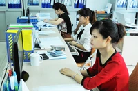 Các doanh nghiệp sẵn sàng các điều kiện để triển khai áp dụng chuẩn mực báo cáo tài chính quốc tế. Ảnh: NAM ANH