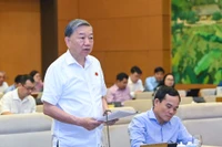 Bộ trưởng Công an Tô Lâm trình bày Tờ trình về dự án Luật Phòng, chống mua bán người (sửa đổi). (Ảnh: DUY LINH)