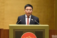 Bộ trưởng Giao thông vận tải Nguyễn Văn Thắng trình bày Tờ trình về việc điều chỉnh chủ trương đầu tư Dự án Cảng hàng không quốc tế Long Thành. (Ảnh: DUY LINH)