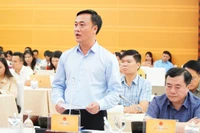 Thứ trưởng Xây dựng Nguyễn Việt Hùng trả lời câu hỏi của phóng viên các cơ quan thông tấn, báo chí. 