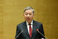 Đại tướng Tô Lâm, Ủy viên Bộ Chính trị, Bộ trưởng Công an trình bày Tờ trình về dự án Luật sửa đổi, bổ sung một số điều của Luật Cảnh vệ. (ẢNH: LINH KHOA)