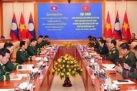 Đoàn đại biểu quân sự cấp cao Quân đội nhân dân Việt Nam do Đại tướng Nguyễn Tân Cương dẫn đầu hội đàm với Đoàn đại biểu quân sự cấp cao Quân đội nhân dân Lào do Trung tướng Saichay Kommasith dẫn đầu. 