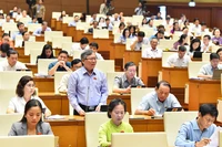 Đại biểu Quốc hội tỉnh Kon Tum phát biểu thảo luận dự thảo Luật Lực lượng tham gia bảo vệ an ninh, trật tự ở cơ sở. (Ảnh THỦY NGUYÊN)
