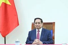 Thủ tướng Chính phủ Phạm Minh Chính điện đàm với Thủ tướng Singapore Lawrence Wong. (Ảnh: TRẦN HẢI)