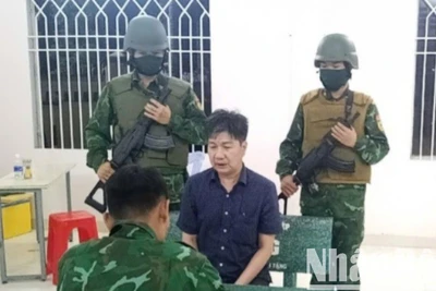 Phạm Mạnh Tân bị lực lượng chức năng bắt giữ.