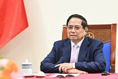 Thủ tướng Chính phủ Phạm Minh Chính điện đàm với Thủ tướng Malaysia Anwar Ibrahim. (Ảnh: Trần Hải)