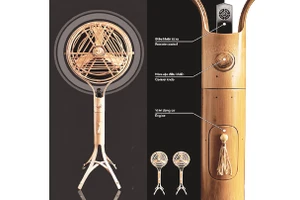 Nhà thiết kế trẻ Nguyễn Huỳnh Nam và chiếc quạt tre do anh thiết kế.