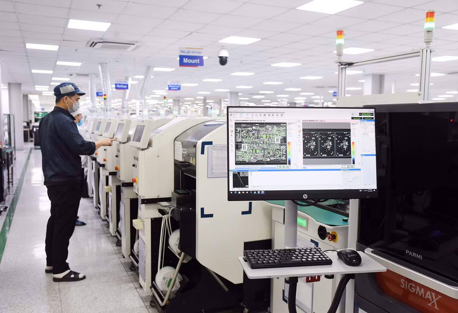 Dây chuyền sản xuất linh kiện điện tử của Công ty TNHH Bumjin Electronics Vina (Quảng Ninh). Dây chuyền sản xuất linh kiện điện tử của Công ty TNHH Bumjin Electronics Vina (Quảng Ninh).