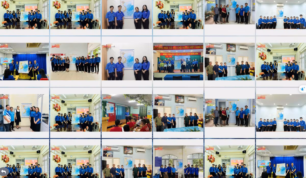 Các bạn trẻ treo bản đồ Tổ quốc tại không gian học tập, làm việc.