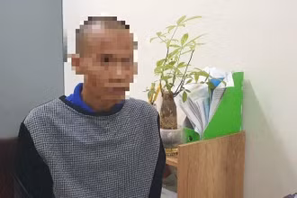 Tài xế Trần Doãn Tùng tại cơ quan Công an.