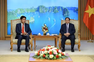 Thủ tướng Phạm Minh Chính tiếp Bộ trưởng Bộ Tư pháp Lào Phayvy Siboualypha. (Ảnh: Thanh Hải)