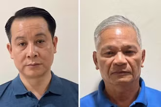 Bị can Phạm Hoàng Anh (bên trái) và bị can Lê Viết Chữ (bên phải).