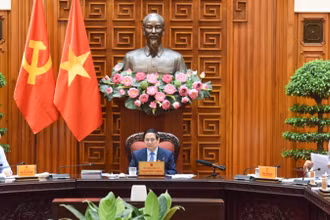 Thủ tướng Chính phủ Phạm Minh Chính chủ trì cuộc họp Thường trực Chính phủ với các bộ, ngành liên quan để chuẩn bị đàm phán thương mại với Hoa Kỳ. (Ảnh: TRẦN HẢI). 