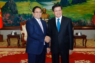 Thủ tướng Phạm Minh Chính và Tổng Bí thư, Chủ tịch nước Lào Thongloun Sisoulith. (Ảnh: THANH GIANG)