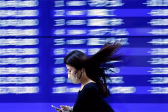 Tại Nhật Bản, chỉ số Nikkei đã tăng lên mức cao nhất kể từ tháng 7/1990. (Ảnh: Reuters)
