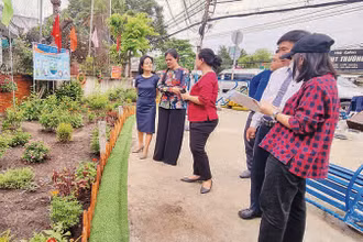 Một điểm đen về môi trường tại xã Đa Phước, huyện Bình Chánh đã được cải tạo thành một khuôn viên cây xanh và sân thể dục. 