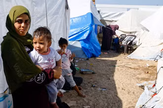 Người dân Palestine tại một trại tị nạn ở Dải Gaza. (Ảnh REUTERS)
