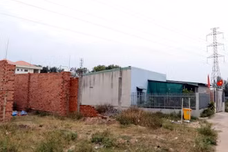 Các ngôi nhà xây trái phép dưới đường dây điện 110kV ở tờ bản đồ số 18, thị trấn Hiệp Phước, huyện Nhơn Trạch.