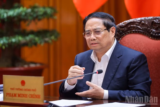 Thủ tướng Chính phủ Phạm Minh Chính chủ trì cuộc họp về điều hành kinh tế vĩ mô. (Ảnh: TRẦN HẢI) 