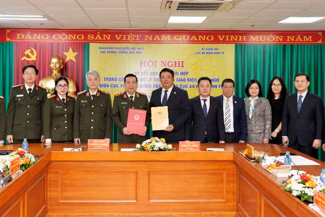 Lễ ký kết giữa đại diện Cục Phòng, chống rửa tiền và Cục An ninh kinh tế.